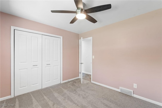 1892 Toepfer Rd, Akron, OH 44312 - unfurnished bedroom with carpet floors, baseboards, a closet, and ceiling fan