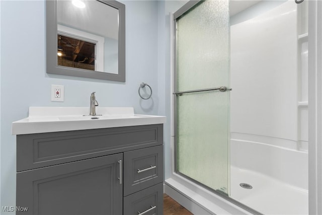1892 Toepfer Rd, Akron, OH 44312 - bathroom with an enclosed shower, vanity, and wood finished floors