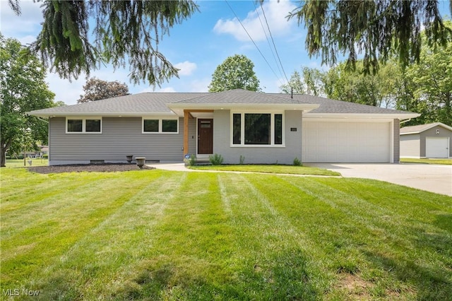 1892 Toepfer Rd, Akron, OH 44312 - ranch-style house with driveway, a front yard, and an attached garage