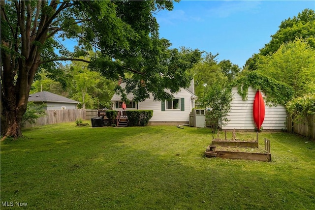 1094 Jessie Ave, Kent, OH 44240 - view of yard featuring a vegetable garden and a deck