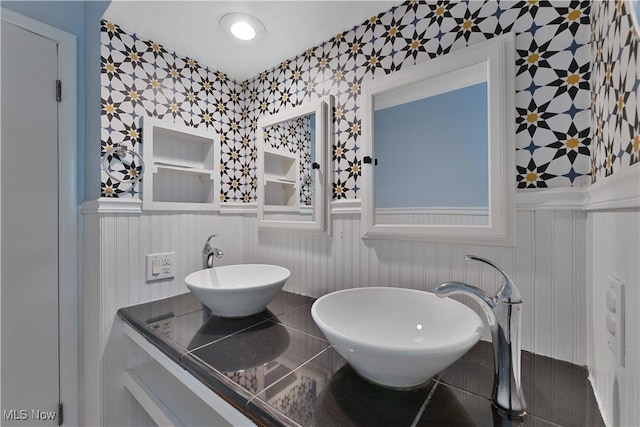 1094 Jessie Ave, Kent, OH 44240 - bathroom with wallpapered walls, wainscoting, a decorative wall, and vanity