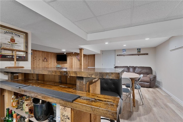 1094 Jessie Ave, Kent, OH 44240 - indoor wet bar with light wood finished floors, baseboards, wooden walls, recessed lighting, and a paneled ceiling