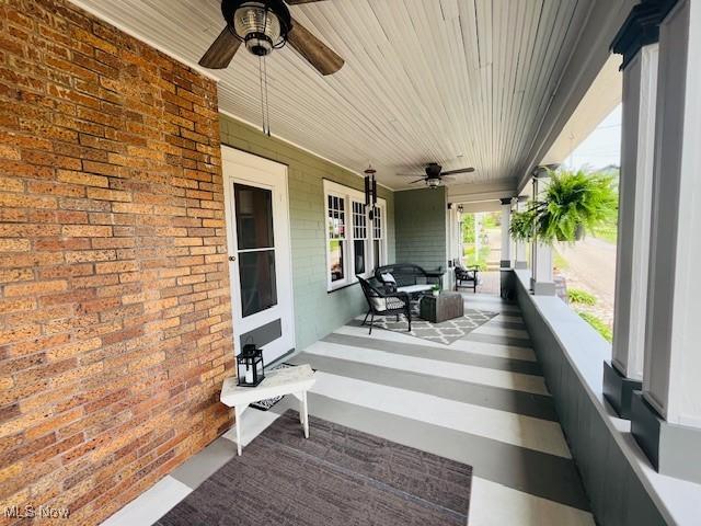161 W Main St, New Concord, OH 43762 - covered porch featuring ceiling fan