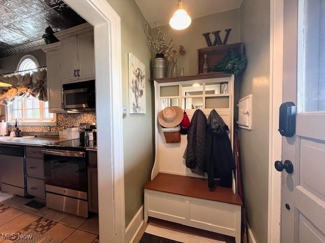 161 W Main St, New Concord, OH 43762 - mudroom featuring a sink and an ornate ceiling