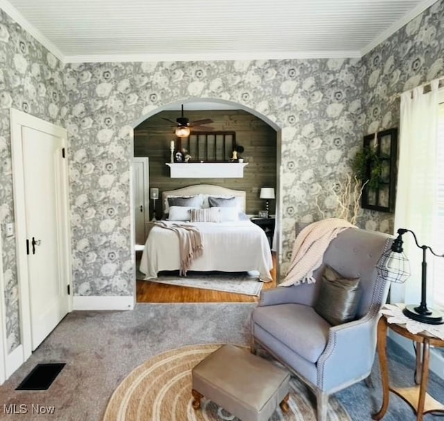 161 W Main St, New Concord, OH 43762 - bedroom with ornamental molding, arched walkways, carpet, wallpapered walls, and baseboards