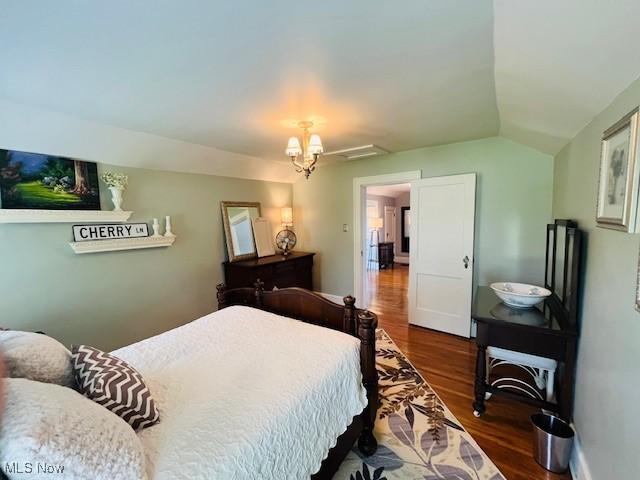 161 W Main St, New Concord, OH 43762 - bedroom with wood finished floors and lofted ceiling