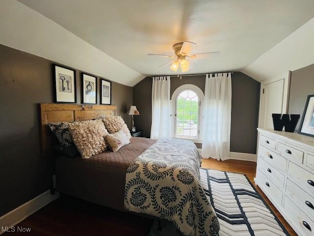 161 W Main St, New Concord, OH 43762 - bedroom featuring vaulted ceiling, baseboards, wood finished floors, and a ceiling fan
