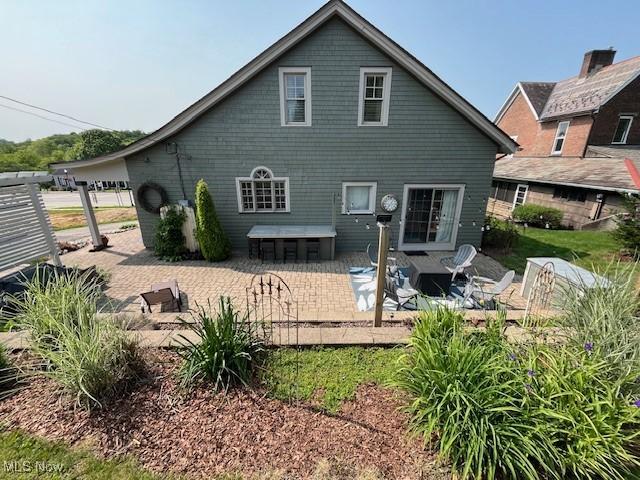161 W Main St, New Concord, OH 43762 - back of house with a patio area