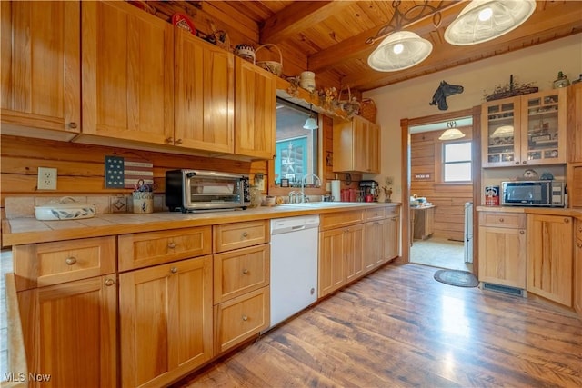 6165 Tyro St NE, Louisville, OH 44641 - kitchen with dishwasher, stainless steel microwave, a sink, wooden ceiling with exposed beams, and light wood-style floors