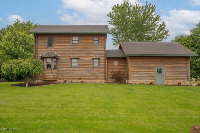6165 Tyro St NE, Louisville, OH 44641 - rear view of property with a lawn