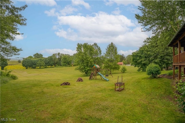 6165 Tyro St NE, Louisville, OH 44641 - view of green lawn featuring a playground