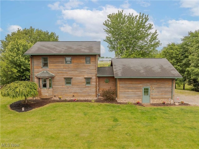 6165 Tyro St NE, Louisville, OH 44641 - rear view of house with a lawn