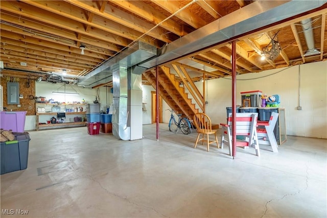 6165 Tyro St NE, Louisville, OH 44641 - unfinished below grade area with electric panel, stairway, and heating unit