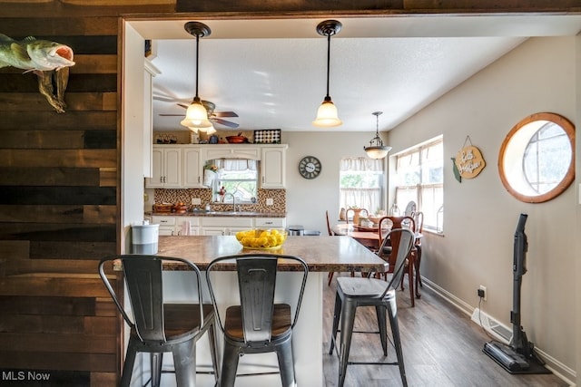 396 2nd St NE, Carrollton, OH 44615 - dining space featuring baseboards, dark wood-style floors, and a ceiling fan