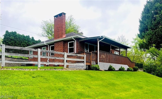 396 2nd St NE, Carrollton, OH 44615 - view of front of home with a front lawn and a chimney