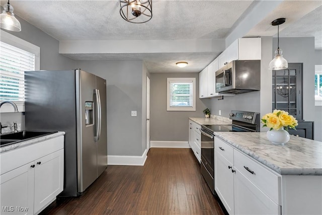 990 Franklin Ave, Salem, OH 44460 - kitchen featuring appliances with stainless steel finishes, baseboards, dark wood-style flooring, a sink, and white cabinetry