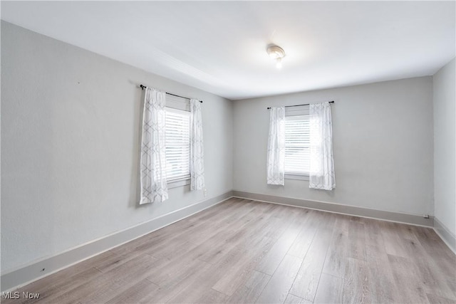 990 Franklin Ave, Salem, OH 44460 - unfurnished room featuring plenty of natural light, wood finished floors, and baseboards