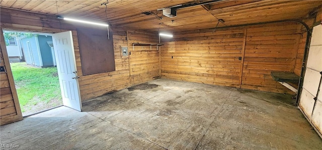 816 Clarendon Ave NW, Canton, OH 44708 - garage with wooden ceiling and wood walls