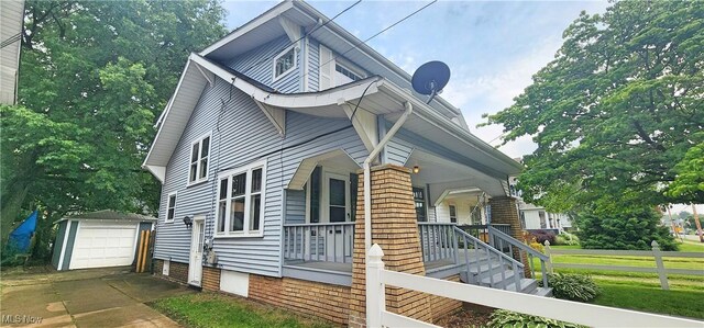 816 Clarendon Ave NW, Canton, OH 44708 - view of home's exterior featuring an outbuilding, a porch, and a detached garage