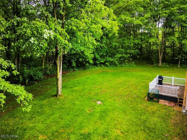 51406 Cornerstone Dr, Petersburg, OH 44454 - view of green lawn with a wooden deck