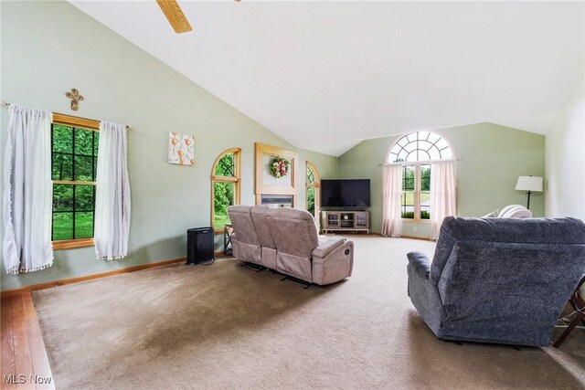 51406 Cornerstone Dr, Petersburg, OH 44454 - carpeted living room with lofted ceiling, a ceiling fan, and baseboards
