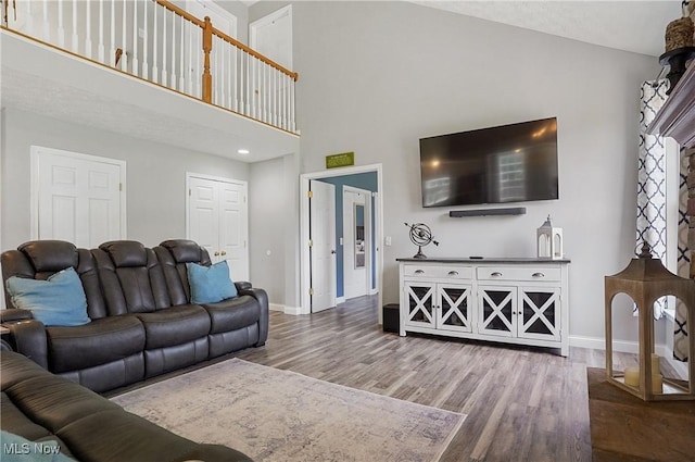 269 Brookledge Ln, Copley, OH 44321 - living room with baseboards, wood finished floors, and a towering ceiling