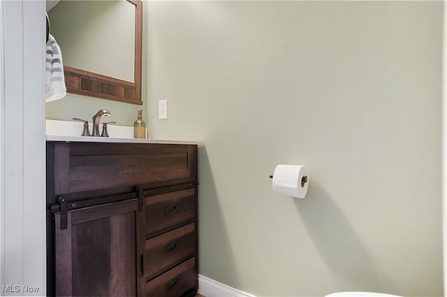 269 Brookledge Ln, Copley, OH 44321 - bathroom featuring vanity, toilet, and baseboards