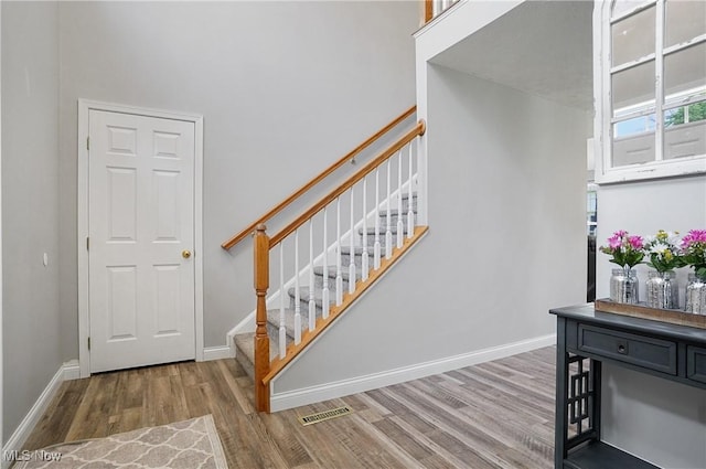 269 Brookledge Ln, Copley, OH 44321 - staircase with wood finished floors and baseboards