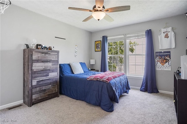 269 Brookledge Ln, Copley, OH 44321 - bedroom featuring light carpet, baseboards, ceiling fan, and a textured ceiling