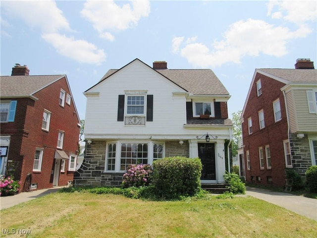 3659 Riedham Rd, Shaker Heights, OH 44120 - traditional-style home featuring a front yard and stone siding
