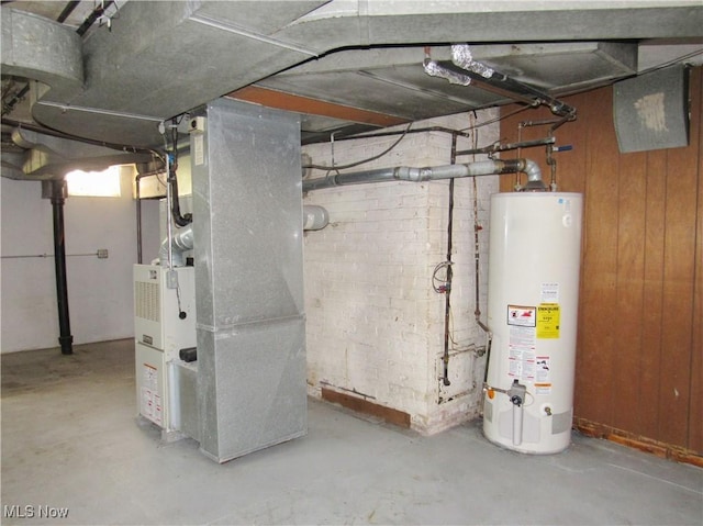 3659 Riedham Rd, Shaker Heights, OH 44120 - below grade area with gas water heater, heating unit, and wooden walls