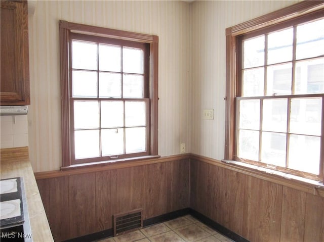 3659 Riedham Rd, Shaker Heights, OH 44120 - unfurnished dining area featuring wallpapered walls and a wainscoted wall