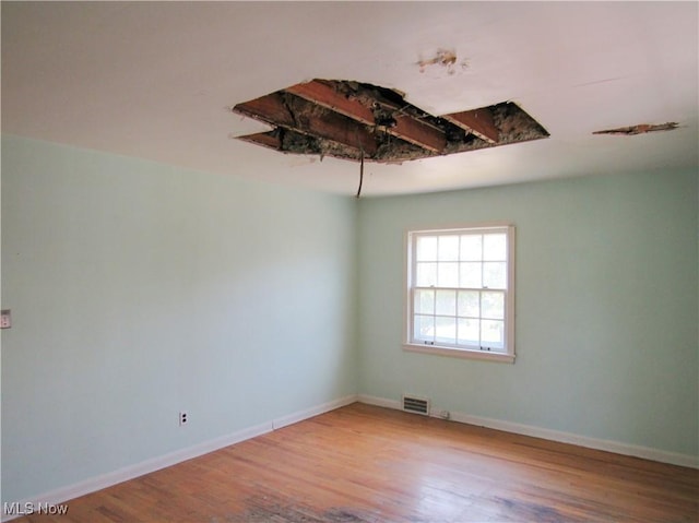 3659 Riedham Rd, Shaker Heights, OH 44120 - empty room with wood finished floors and baseboards