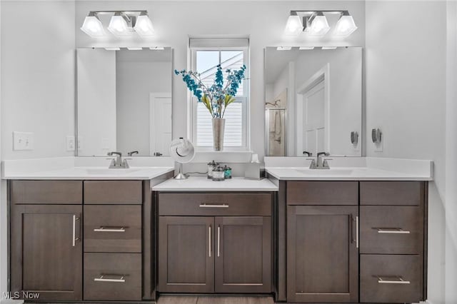 34655 N Legends Way, Grafton, OH 44044 - full bathroom featuring two vanities and a shower with shower door