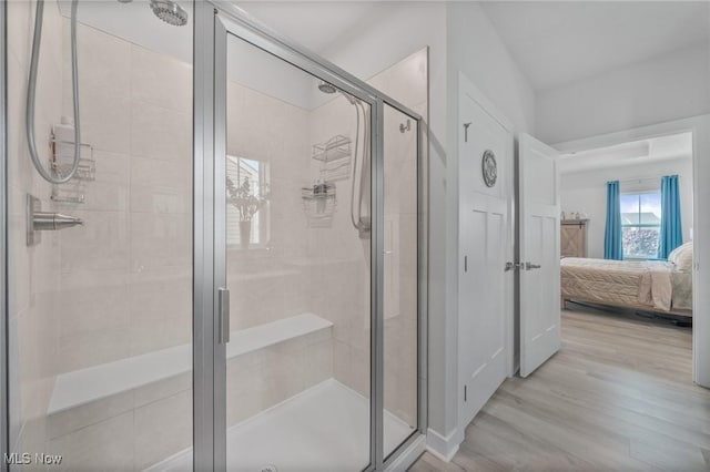 34655 N Legends Way, Grafton, OH 44044 - bathroom featuring ensuite bath, wood finished floors, and a shower stall