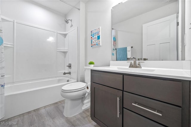 34655 N Legends Way, Grafton, OH 44044 - bathroom featuring wood finished floors, vanity, and tub / shower combination
