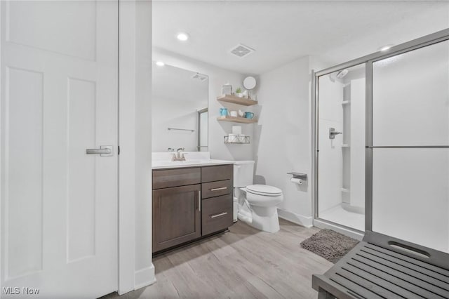 34655 N Legends Way, Grafton, OH 44044 - bathroom featuring vanity, a shower stall, wood finished floors, and recessed lighting