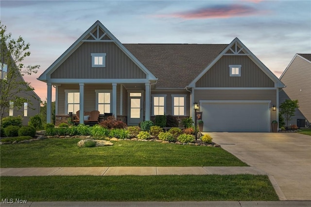 34655 N Legends Way, Grafton, OH 44044 - craftsman inspired home featuring concrete driveway, board and batten siding, a front yard, and covered porch