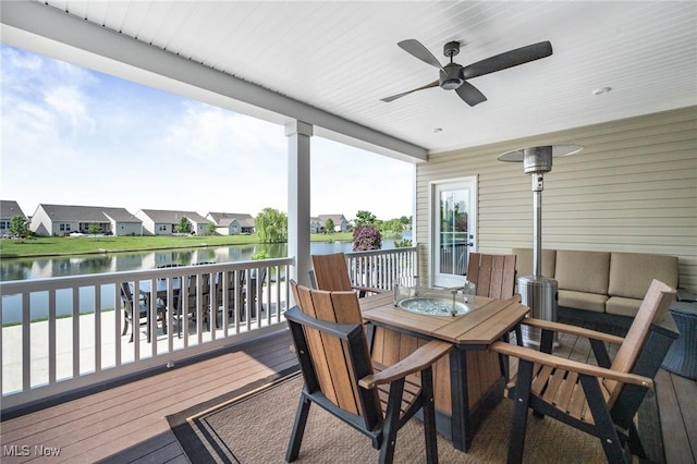 34655 N Legends Way, Grafton, OH 44044 - wooden deck featuring a water view, ceiling fan, outdoor dining space, and a residential view