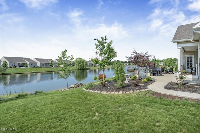 34655 N Legends Way, Grafton, OH 44044 - view of grassy yard featuring a water view, a patio area, and a residential view
