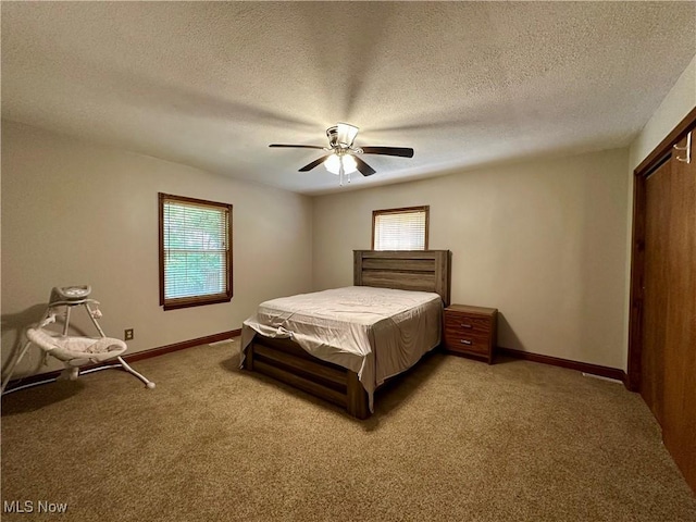 102 Wylie Dr, Short Creek, WV 26058 - bedroom with light colored carpet, baseboards, a textured ceiling, and ceiling fan