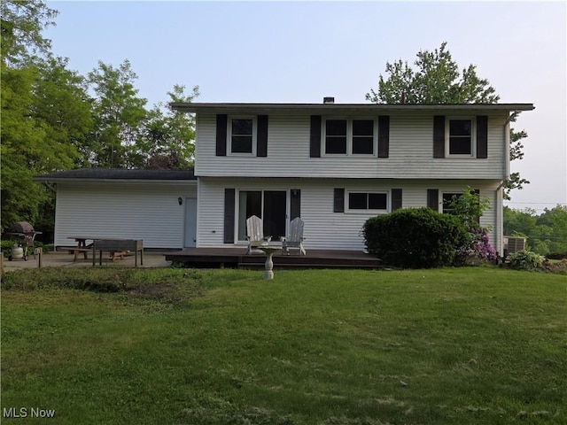1025 S Ridge Rd, Geneva, OH 44041 - back of house with a wooden deck and a lawn