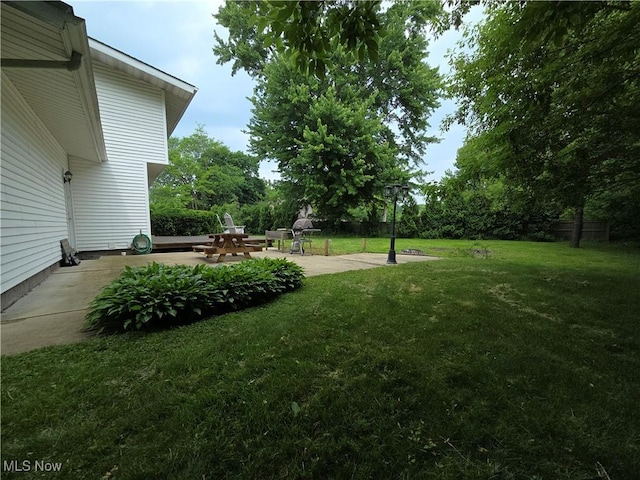 1025 S Ridge Rd, Geneva, OH 44041 - view of green lawn featuring a patio area