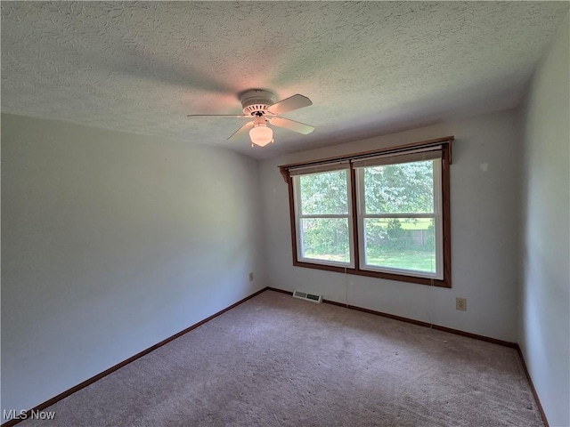 1025 S Ridge Rd, Geneva, OH 44041 - carpeted empty room featuring a textured ceiling, a ceiling fan, and baseboards