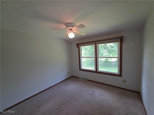1025 S Ridge Rd, Geneva, OH 44041 - empty room with carpet floors, a textured ceiling, baseboards, and a ceiling fan