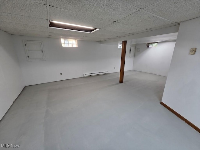 1025 S Ridge Rd, Geneva, OH 44041 - below grade area featuring baseboard heating and a paneled ceiling