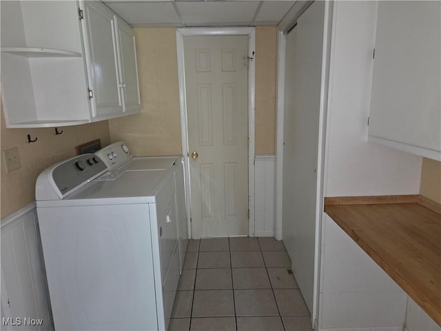 1025 S Ridge Rd, Geneva, OH 44041 - laundry room featuring cabinet space, independent washer and dryer, and light tile patterned floors