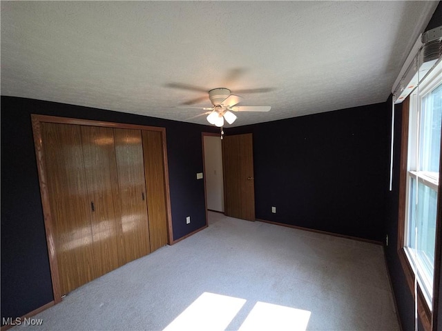 1025 S Ridge Rd, Geneva, OH 44041 - unfurnished bedroom featuring carpet flooring, a ceiling fan, and a closet