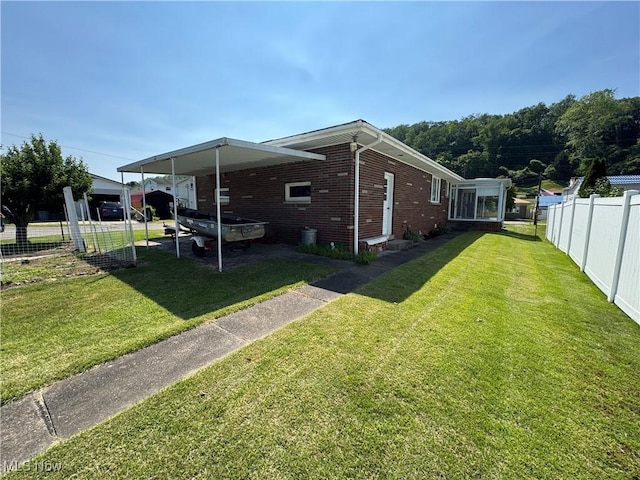 158 Main St, Rayland, OH 43943 - view of side of home featuring brick siding and an attached carport