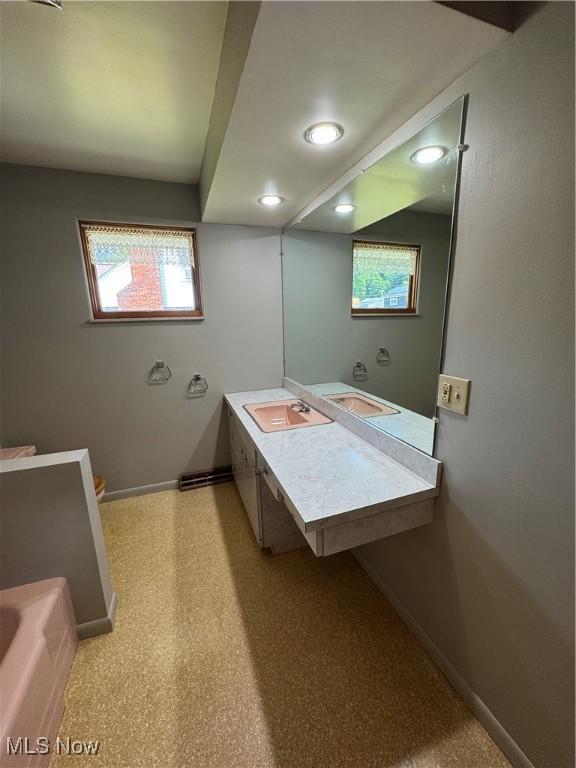 158 Main St, Rayland, OH 43943 - bathroom featuring baseboards, recessed lighting, a bathtub, and vanity